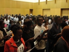 A cross-section of members of the audience singing the song ’Kaze ni Naritai’