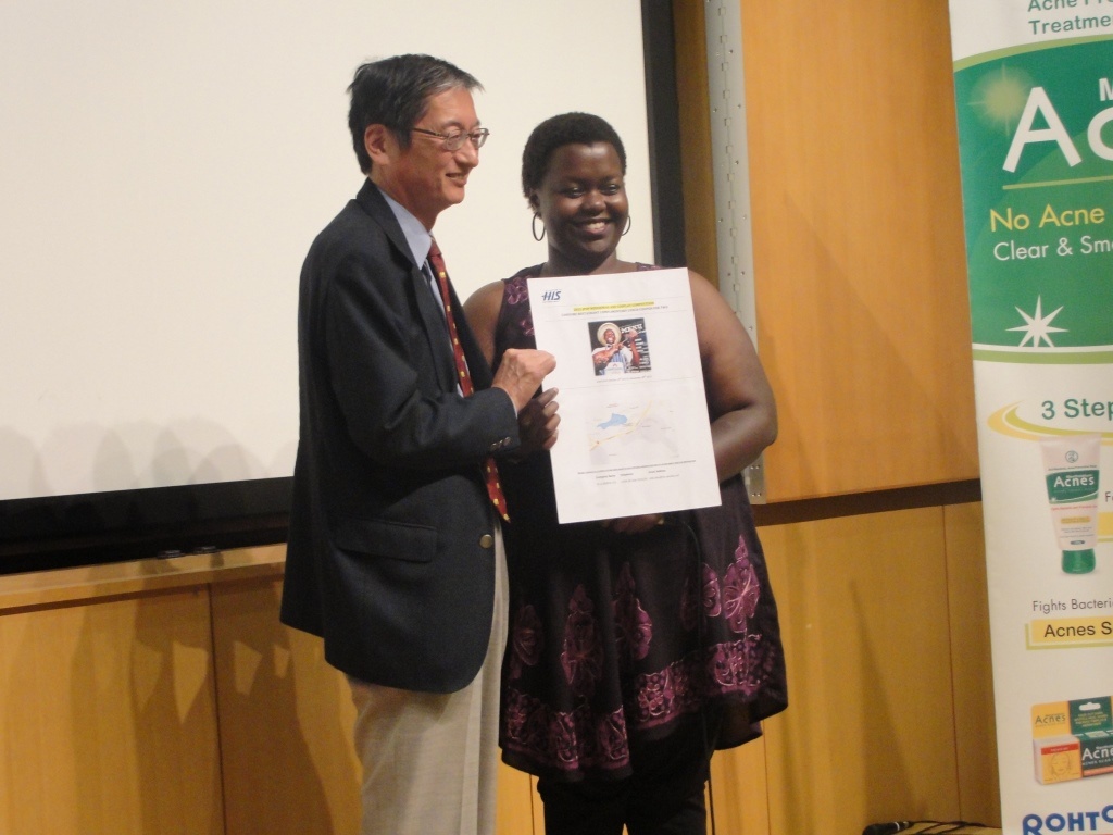 The winner of the J-Pop Nodojiman receiving her award from H.E. Ambassador Terada