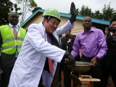Mr. Mori laying the stone at the project site
