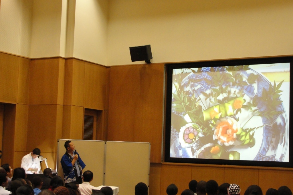 Chef Kobayashi demonstrating how to prepare and serve kazari maki zushi