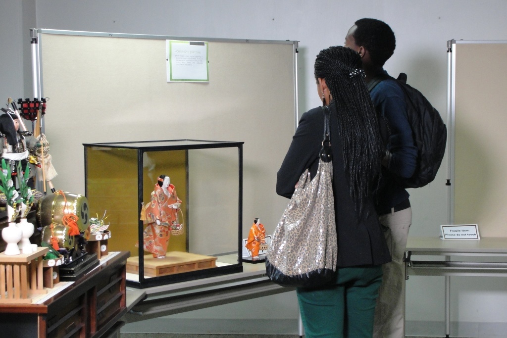 Some of the visitors viewing the displayed dolls