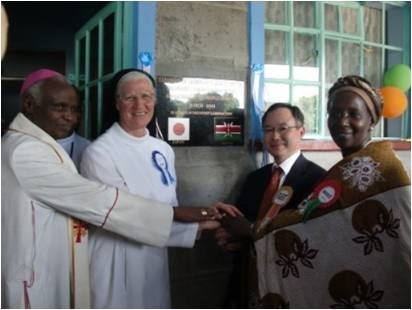 (left to right) Bishop Korir, Sr. Michael Mary, Mr. Yamada and MP Hon. Kilimo in front of a memorial plaque at the entrance