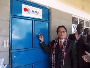 Mr. Mori cutting the ribbon