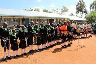 Pupils expressing joy by singing and dancing