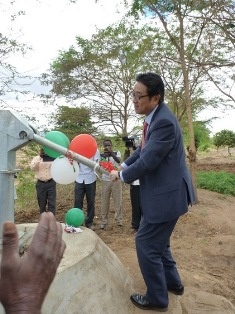 Mr. Mikio Mori pumping water at one of the newly constructed shallow wells