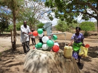 Community members collecting water for the ceremony
