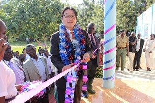 Mr. Mori cutting the ribbon
