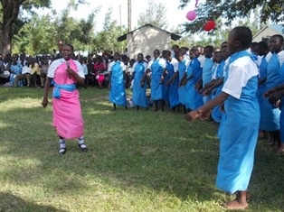 Students expressing joy by singing and dancing