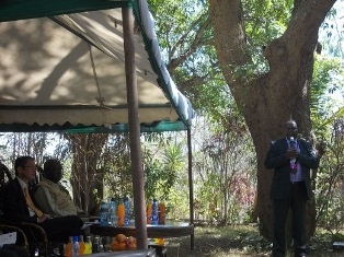 Hon. Dr. Julius Makau Malombe giving a speech