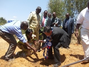 H.E. Terada planting a tree