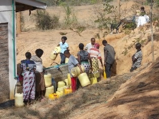People coming to fetch water at the kiosk