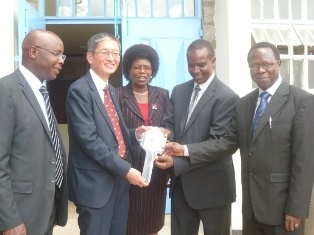H.E. Terada handing over the key to the Neema Hospital