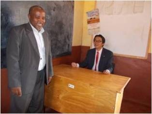 Observation of the classrooms: Mr. Mori with the School Chairperson, Mr. Godfrey M. Rumo