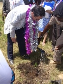 Ambassador Terada planting a tree