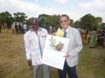 Ambassador Terada presenting Japan Ikebana Calendar 2015 as a gift to Olengoloto Primary School