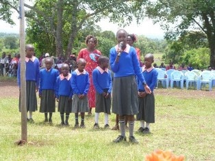 Olengoloto Primary School Pupils expressing joy by singing Masai traditional folk song and performance