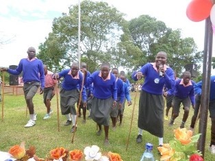 Olengoloto Primary School Pupils expressing joy by singing Masai traditional folk song and performance