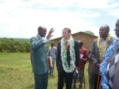 H.E. Mr. Terada touring the current school facilities with Head Teacher and Chairman