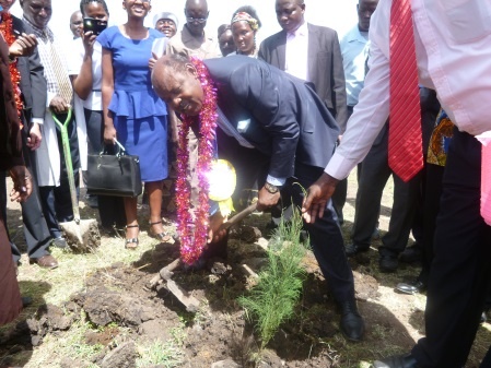 Governor Ranguma planting a tree.