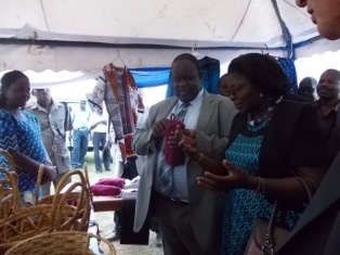 Governor Cyprian Awiti viewing the products made by women at the Empowerment Centre