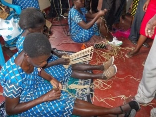 women making the flower baskets with water-hyacinth.