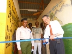 Ambassador Terada cutting the ribbon to open the new school facility.