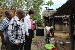 Mr. Mori talking to the cook at the humble kitchen