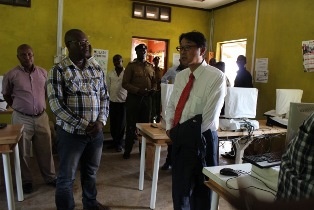 Mr. Mori and Hon. Mustafa touring the school facilities with project coordinator, Mr. Sammy
