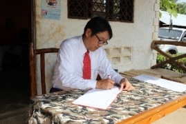 Mr. Mikio Mori, The Deputy Ambassador of Japan to the Republic of Kenya , signing the book