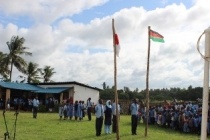 Students paying the respect to national flags of Kenya and Japan