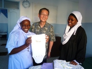 Sr. Veronica showing Ambassador Terada the delivery kit for the new born baby