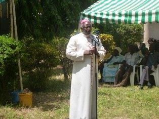 Rev. Bishop Paul Kariuki giving a speech.