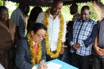 Mr. Mikio Mori, the Deputy Ambassador of Japan signing the visitor’s book.