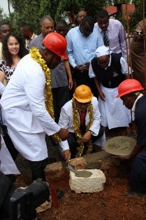 Mr. Mori laying a stone with Governor