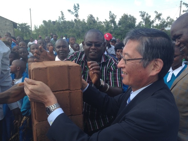 HE Ambassador Terada laying the first stone