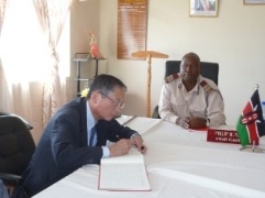 Ambassador Terada signing the visitor’s book at the County Commissioner’s office