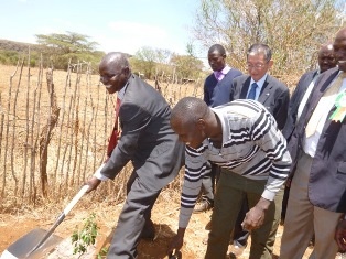 Hon. Mr. Edwin Riamangura, Representative of Baringo County Governor planting a tree.