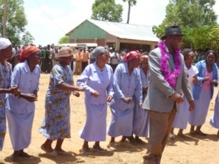 Governor Ongwae dancing together with community members to express their joy