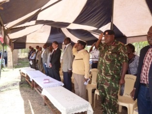 Paying respect to the national anthem of both Kenya and Japan.