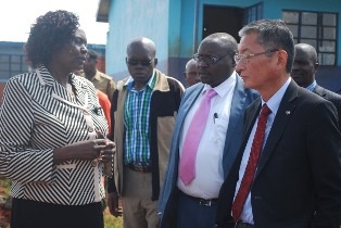 Receiving a brief tour of the project from the head teacher