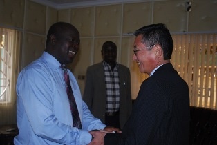 H.E. Mr. Patrick Khaemba and H.E. Mr. Tatsushi Terada greeting each other