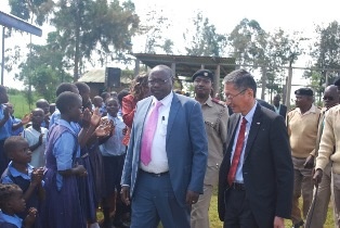 H.E Mr. Tatsushi Terada and H.E. Mr. Stanley Tarus welcomed by the pupils