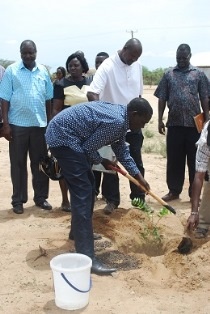H.E. Josphat Nanok planting a tree