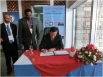 Ambassador Takata signs KEMRI’s visitors book