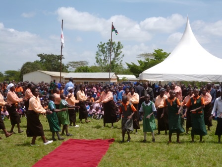Pupils and Misuuni Community members dancing.