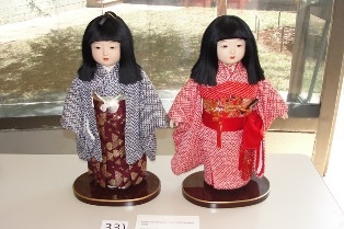 Ichimatsu Ningyo: Pair of Ichimatsu Dolls. Both of these dolls are in formal costumes.