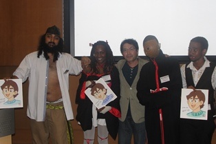 Participants of the Cosplay competition posing for a group photo with Manga Instructor Mr. Matsuda