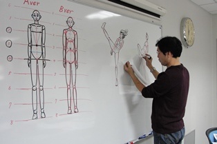 Mr. Matsuda illustrating a point during the Manga Workshop