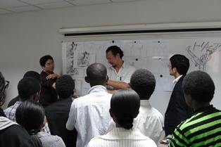 Matsuda explaining a point to participants during the workshop