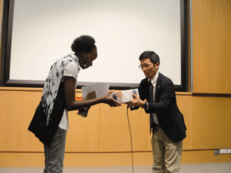 First prize being given to a speech contestant